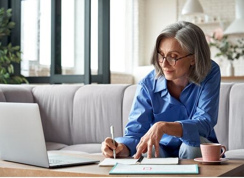 Picture of older person writing what it seems her last wishes